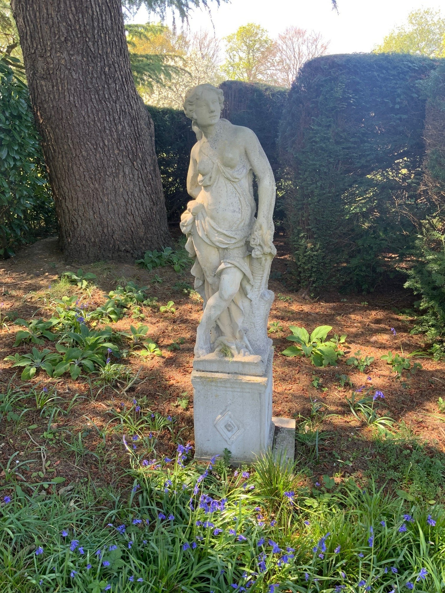 A set of four reconstituted stone garden figures, representing the Four Seasons, tallest 170cm
